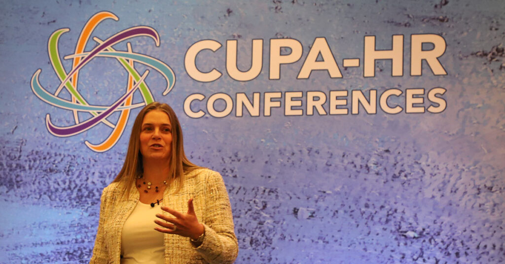 White woman gives talk at a CUPA-HR Conference.